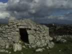 At AGIOS DONATOS, VOLTOI ,domed  stone buildings with halfmeter tick walls used by farmers for keeping their crops ans animals , info publ. by the Lefkada Pref. Tourism committee